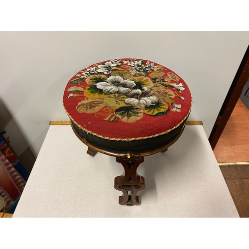 215 - Antique solid wood stool with embroidered seat on unusual carved legs.