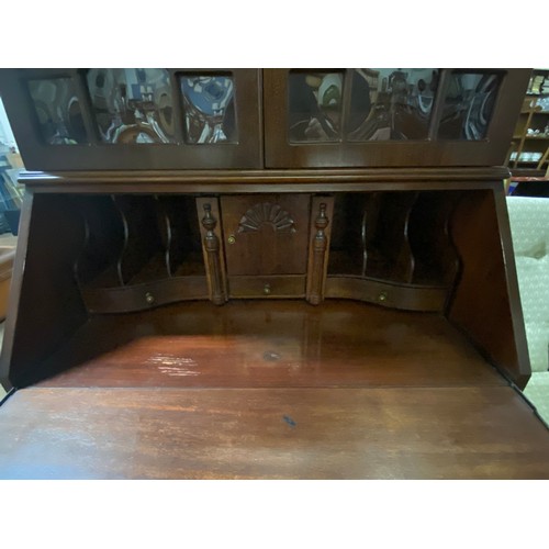 219 - Antique solid wood Bureau/bookcase with bevelled glass panels.
205cm h x 83cm l x 41cm d