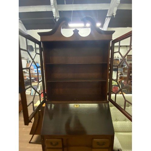 219 - Antique solid wood Bureau/bookcase with bevelled glass panels.
205cm h x 83cm l x 41cm d