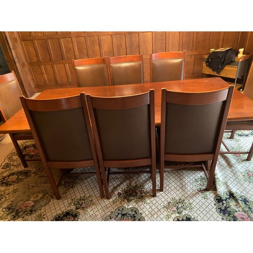 222 - Very large solid wood bespoke dining table with 8 leather studded dining chairs.
229cm l x 109cm d x... 