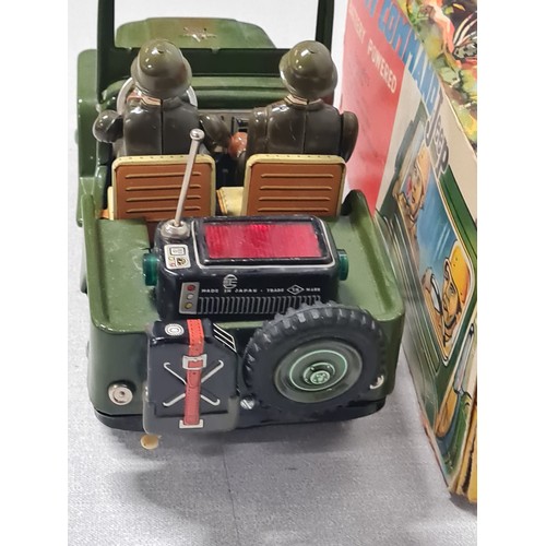 273 - 1960's tin plate Army Command battery operated jeep made by Nomura Japan. Has driver and phone opera... 