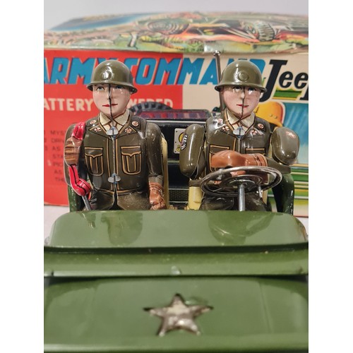 273 - 1960's tin plate Army Command battery operated jeep made by Nomura Japan. Has driver and phone opera... 