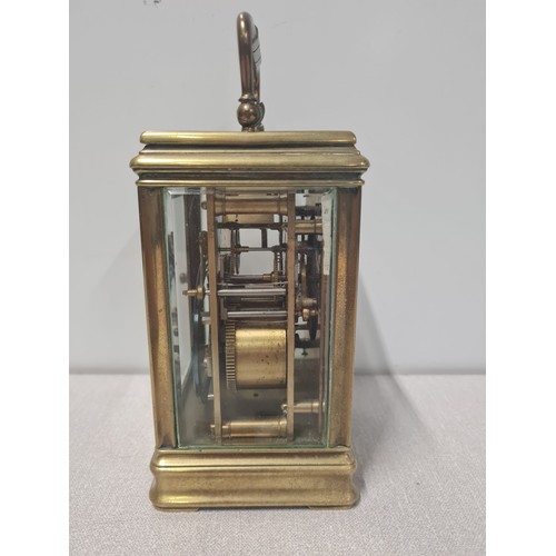 274 - Vintage heavy brass skeleton carriage clock with key.approx H 15cm X D 10cm