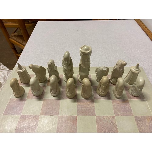 394 - large Carved soapstone chess set and board (damage to 1 piece)