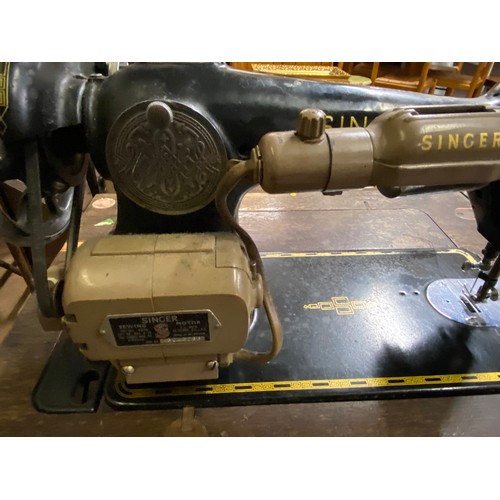 398 - Singer treadle sewing machine in original cabinet.