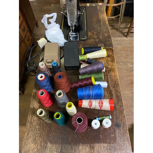 398 - Singer treadle sewing machine in original cabinet.