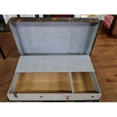 22 - Large vintage travel trunk with insert.