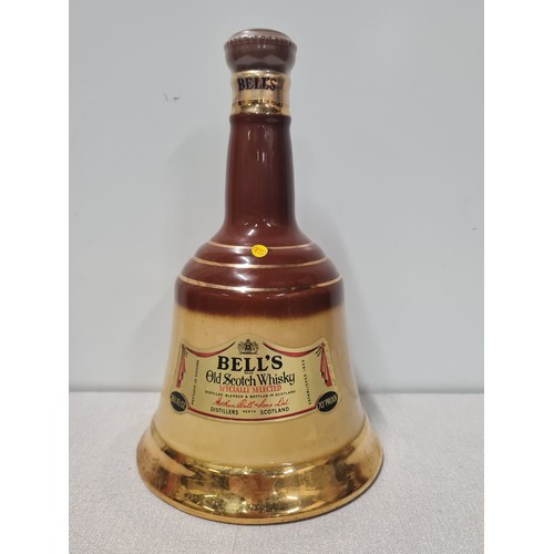 33 - Bells Old Scotch Whisky in Wade decanter full and sealed (70 proof)