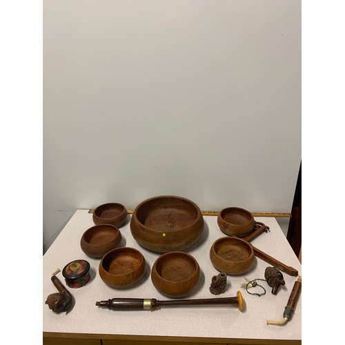 36 - Set of 7 Thai teak bowls along with carved wooden pipes etc.