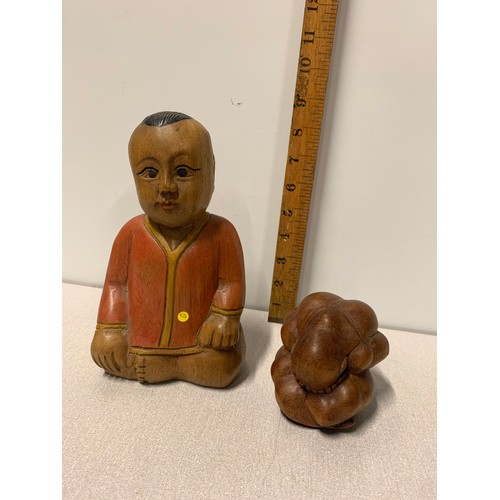 37 - Carved wooden Buddha figure along with hand carved solid wood weeping Buddha.
Tallest 21cm