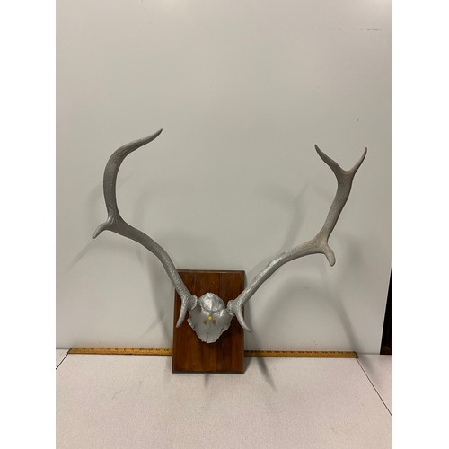 41 - Set of vintage metal antlers on plaque.