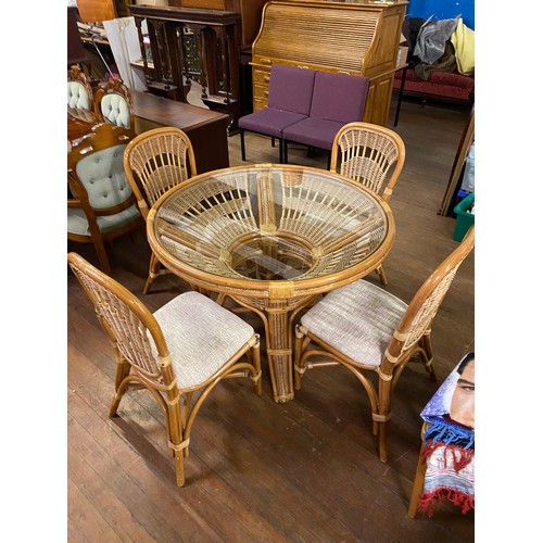 105 - Wicker and bamboo patio set with glass top table and 4 chairs. D 108cm x H 76cm.