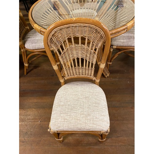 105 - Wicker and bamboo patio set with glass top table and 4 chairs. D 108cm x H 76cm.