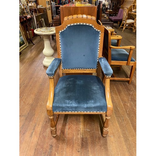 114 - Solid oak throne chair with blue velvet upholstery.