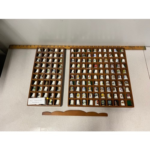 60 - Large collection of Scottish Thimbles in wooden display.