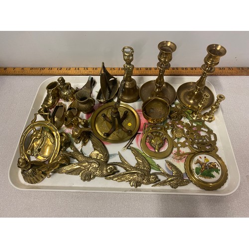 141 - Collection of brass ware to include horse braces and candle sticks etc.