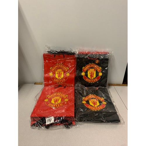 147 - Selection of new Manchester United gift bags.