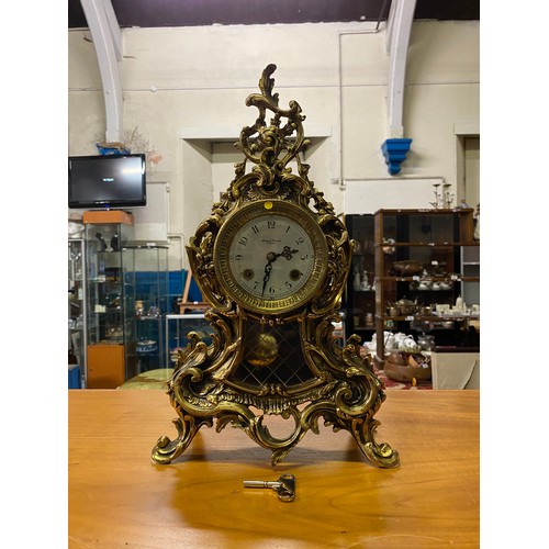 161 - Ornate brass mantle clock with Franz Hermle movement Robert Grant London.
44cm Tall