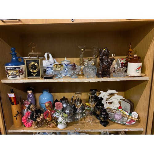 166 - 2 shelves of collectables to include decanter, carriage clock and figures etc.