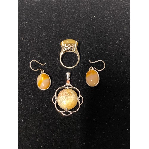 201 - Silver and yellow jade ring, earrings and pendant set.