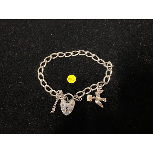 208 - Hallmarked silver heart link bracelet with dove charm.