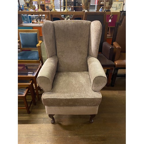 231 - Upholstered wing back arm chair.