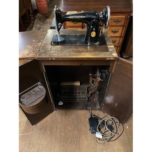 263 - Singer treadle sewing machine in original cabinet.