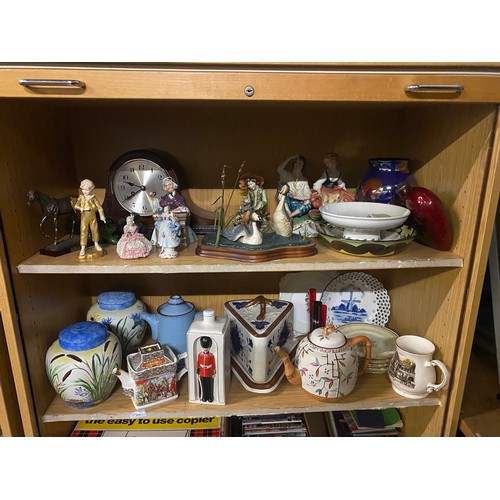 279 - 2 shelves of collectables to include figurines and mantle clock etc.