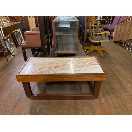 298 - Mid Century Marble top sleigh style coffee table.
(There is no crack on the table it is the pattern ... 