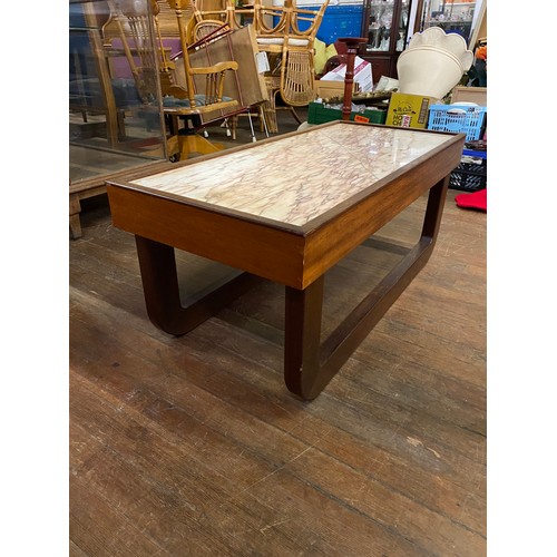 298 - Mid Century Marble top sleigh style coffee table.
(There is no crack on the table it is the pattern ... 