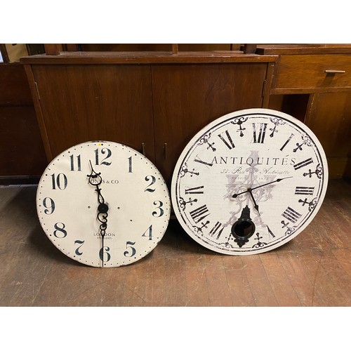 311 - 2 large wall clocks.
Largest 60cm