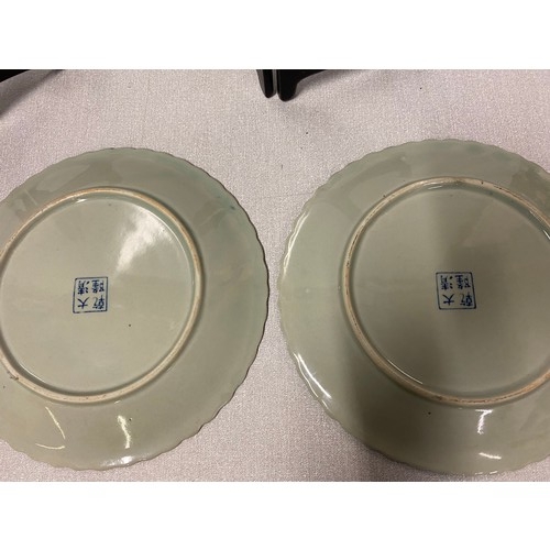 540 - Pair of oriental blue and white display plates. Marked to the back.
25cm Diameter