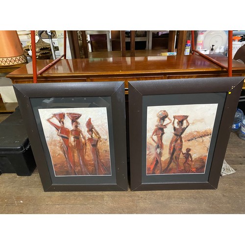 670 - Pair of framed tribes women prints.