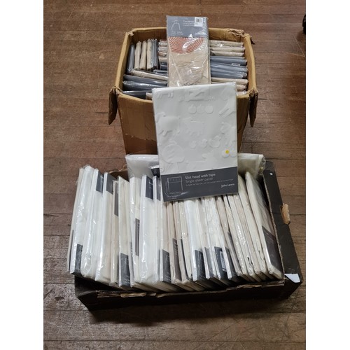 18 - 2 boxes of new John Lewis curtain panels and tie-backs etc.