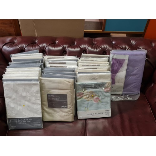 55 - quantity of new Laura Ashley pillow cases and new John Lewis curtain panels.