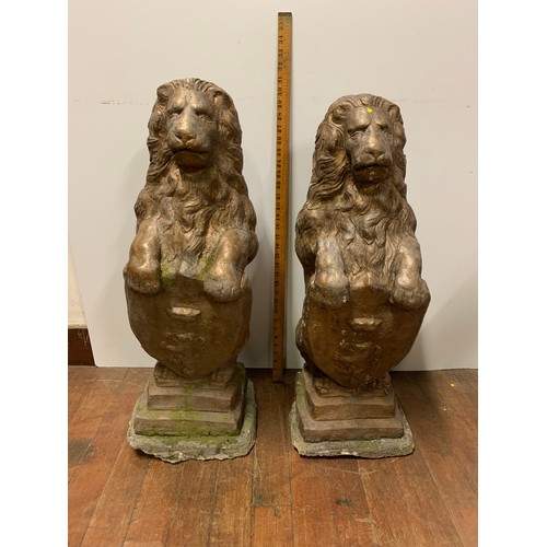 57 - Pair of large vintage stone garden lions holding shields. Very heavy.
78cm Tall