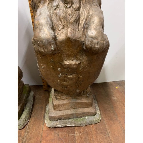 57 - Pair of large vintage stone garden lions holding shields. Very heavy.
78cm Tall