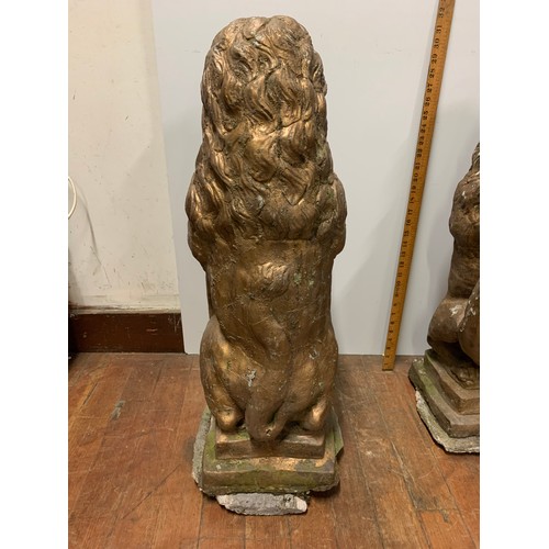 57 - Pair of large vintage stone garden lions holding shields. Very heavy.
78cm Tall