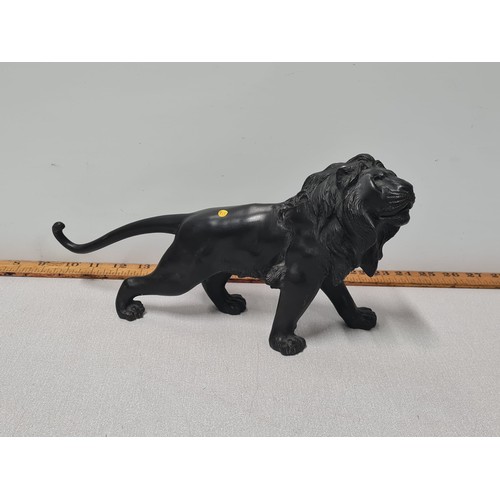 120 - Heavy bronze lion sculpture.
33cm long