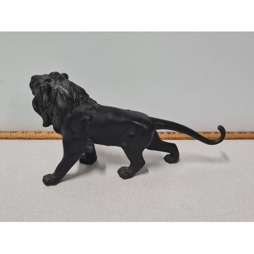 120 - Heavy bronze lion sculpture.
33cm long