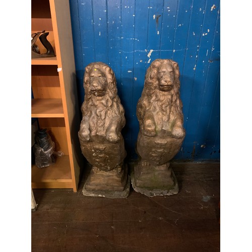 57 - Pair of large vintage stone garden lions holding shields. Very heavy.
78cm Tall