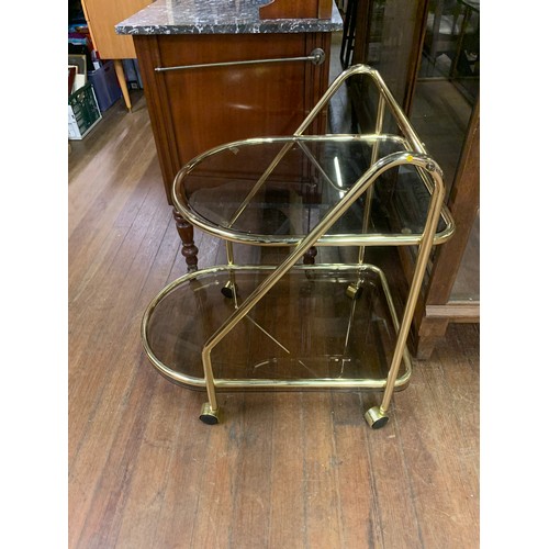 30 - Mid Century brass and glass serving trolley.