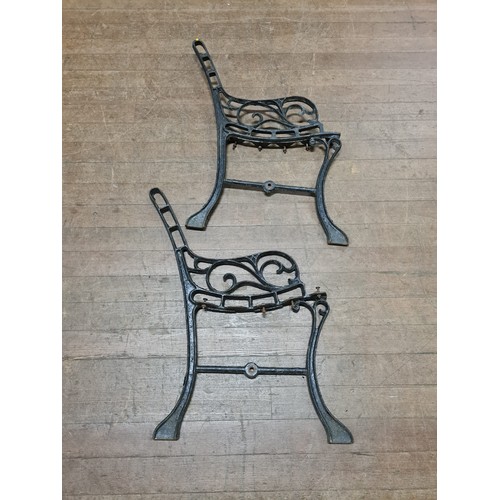 116 - Pair of wrought iron bench ends.