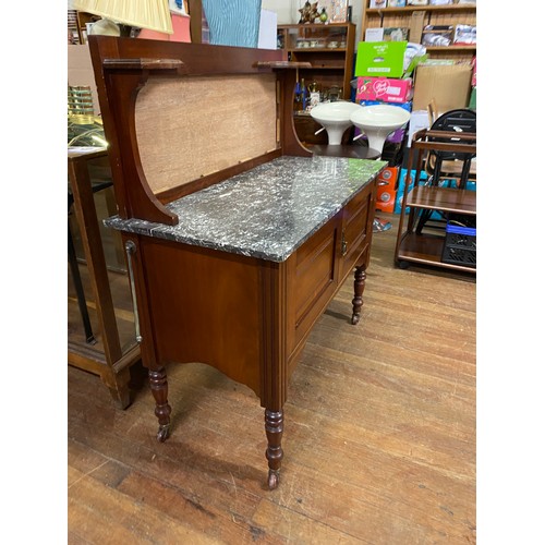 95 - Marble topped cabinet on canisters. H 120cm x L 107cm x W 51cm.