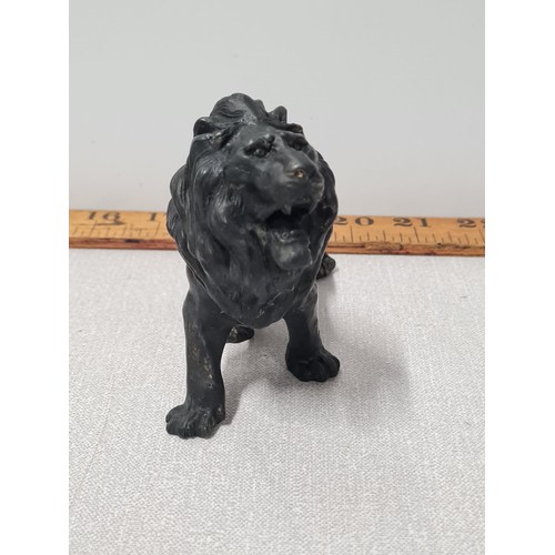 119 - Bronze patented cast lion statue. 10cm x 13cm.