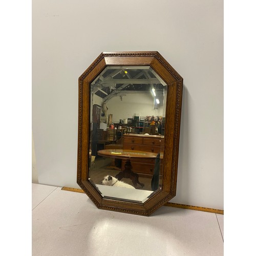 61 - Carved oak beveled edge mirror.
77cm x 50cm