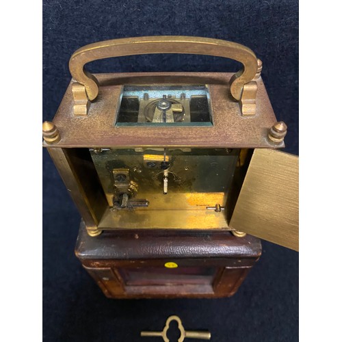 171 - Antique brass carriage clock in original leather case with key 
working
11cm h x 12cm l x 8cm