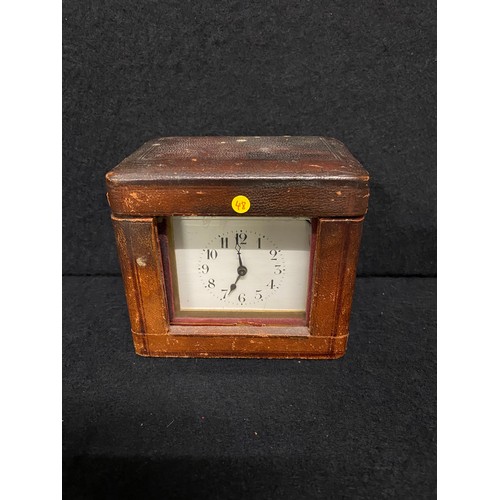 171 - Antique brass carriage clock in original leather case with key 
working
11cm h x 12cm l x 8cm