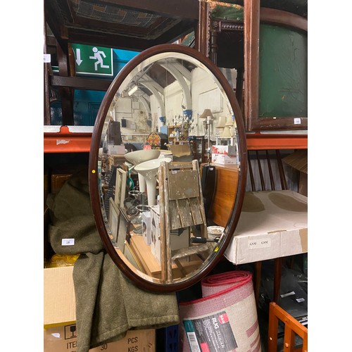 222 - Large oval mahogany framed mirror.