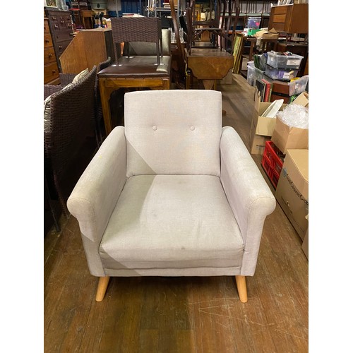 24 - Modern upholstered armchair.